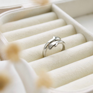 Hug Ring in stainless steel silver , showcasing its sleek and adjustable design 