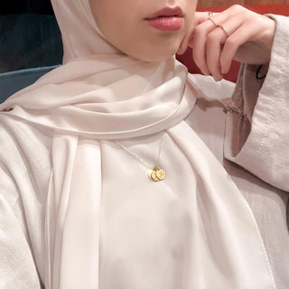 Model wearing the three-coin Happiness Necklace, representing faith and inner peace through Tawakkul, Sabr, and Shukr