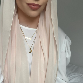 Model wearing Hilal Necklace, featuring a sleek crescent moon pendant perfect for everyday or special occasions